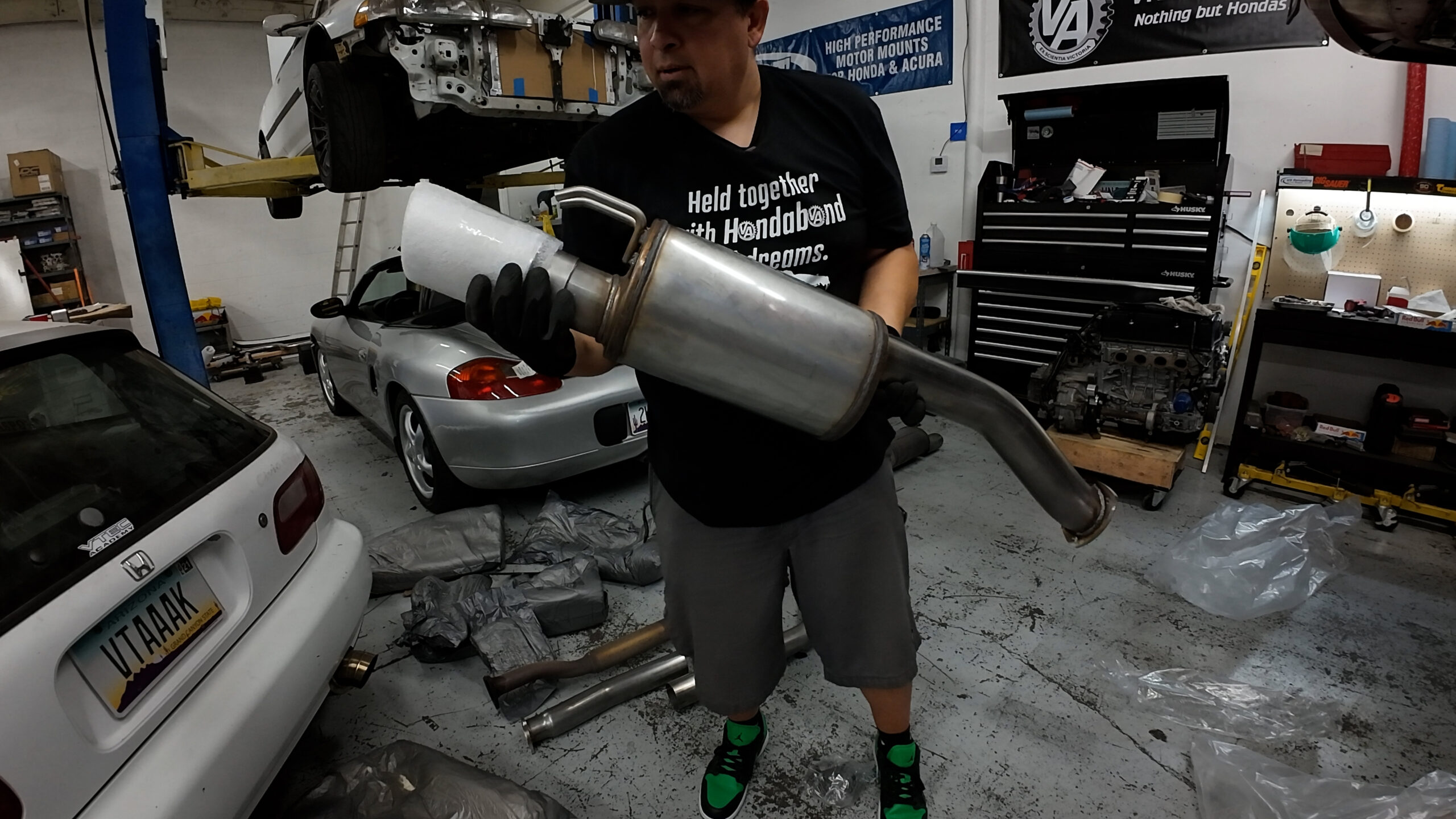 Aaron holds the rear section of a 3 inch Thermal Research and Development exhaust for a FA5 Civic Si sedan.